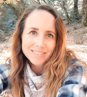 Nicole out in the woods smiling