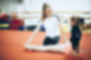 Girl and Coach warming up for gymnastics class