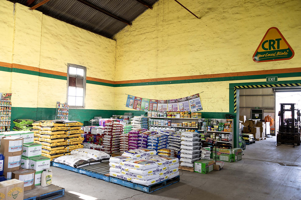 Interior of rural supplies store with shelves stocked with farm and pet products