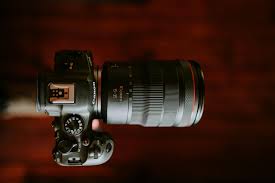 A Canon EOS M camera with Magic Lantern firmware installed, showcasing its compact design and ability to shoot 14-bit raw video."