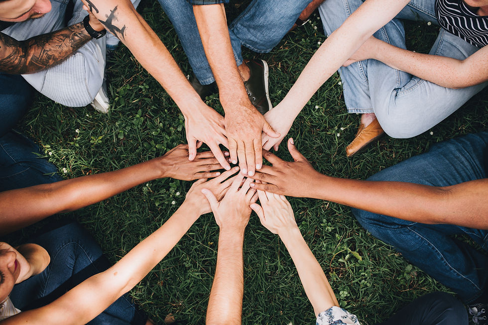 A circle of hands coming together. A circle of friends.