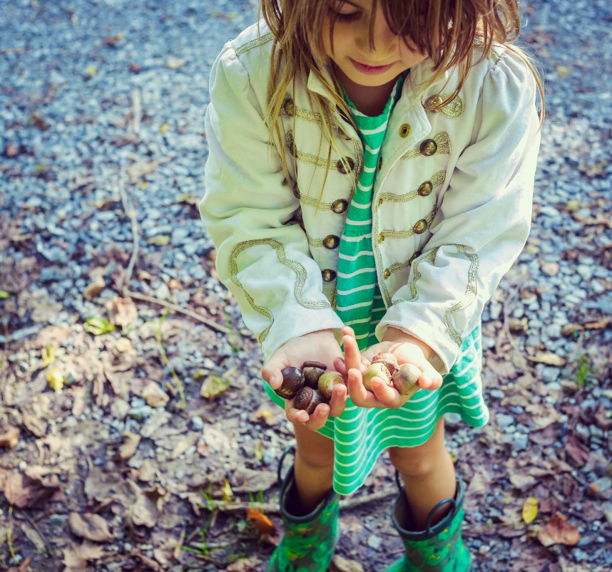 child with rocks, treasures, trinkets, pack rat