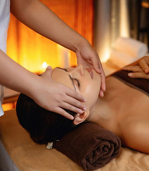 Woman receiving facial massage at spa, relaxation treatment, Thai King Therapy