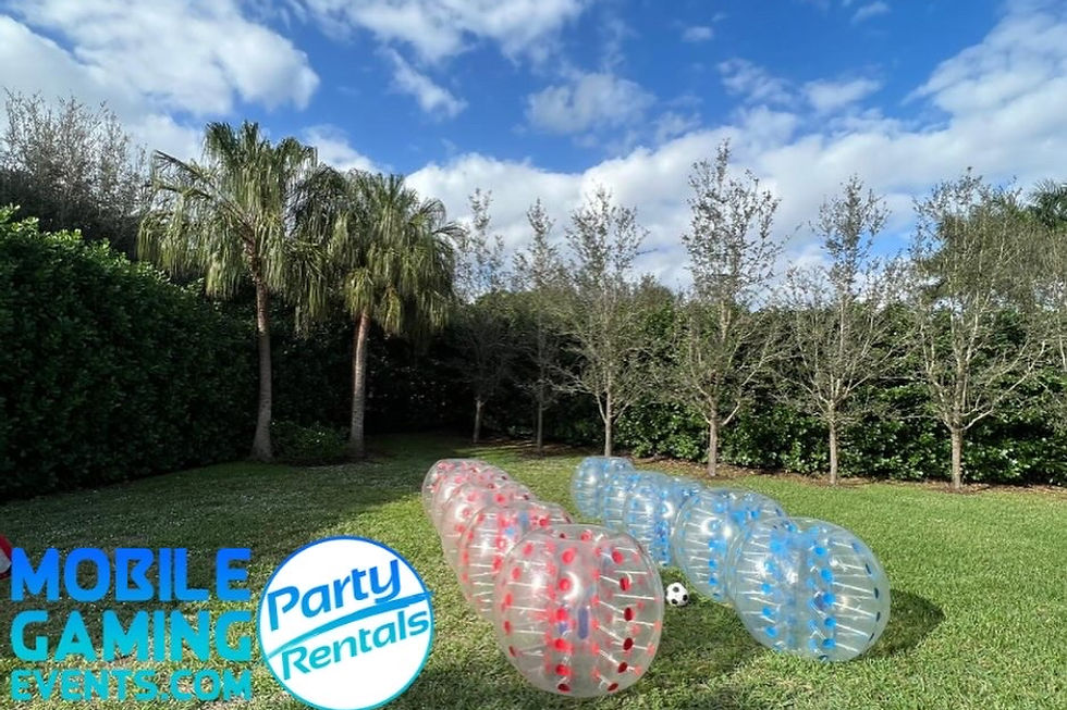 Bubble Soccer rental from Mobile Gaming Events featuring inflatable bubble suits bubble balls soccer goals and supervised team gameplay for birthday parties school events summer camps church youth groups corporate events Bar and Bat Mitzvahs HOA celebrations festivals family events and community gatherings in Roswell. This image represents the Bubble Soccer service offered for events in and around Roswell and does not necessarily mean the photographed event itself took place there. Call or text 954-408-1881 for availability.