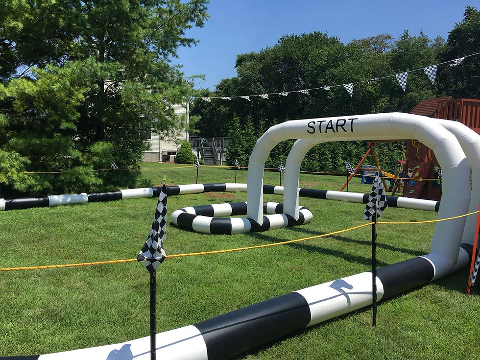 Remote-control car racing track arranged with barriers and turns for an event racing activity.