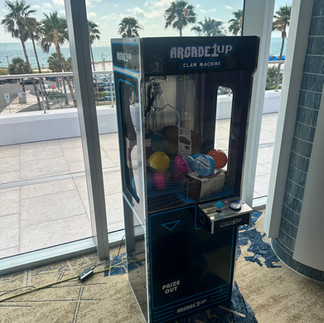 South Florida claw machine rental with vibrant LED lights, perfect for Miami and Ft. Lauderdale trade shows—reserve at 954-408-1881