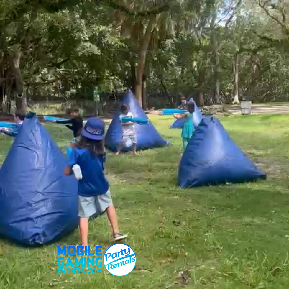 Water-blaster party equipment and outdoor playing area for a group water game.