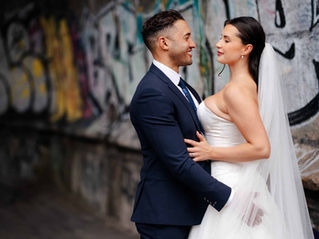 bride and groom in graffiti tunnel