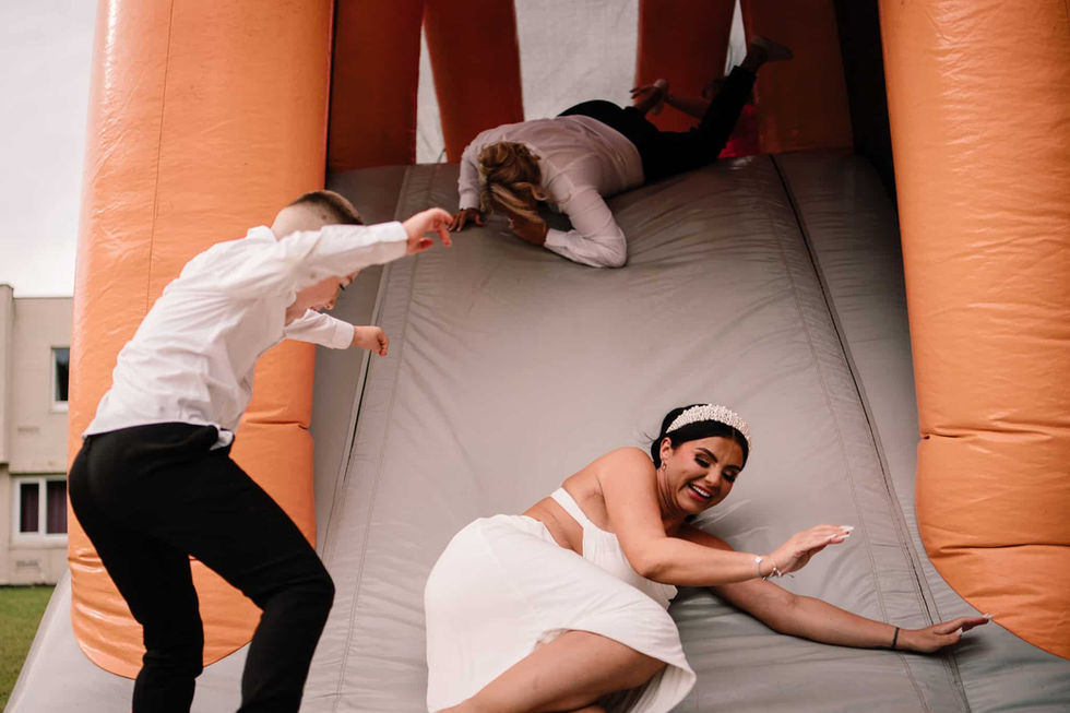 wedding guests on inflatable assault course at sporting lodge middlesbrough