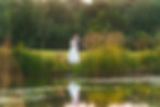 bride and groom cuddling by lake at the hidden oak stockton teesside wedding photographer