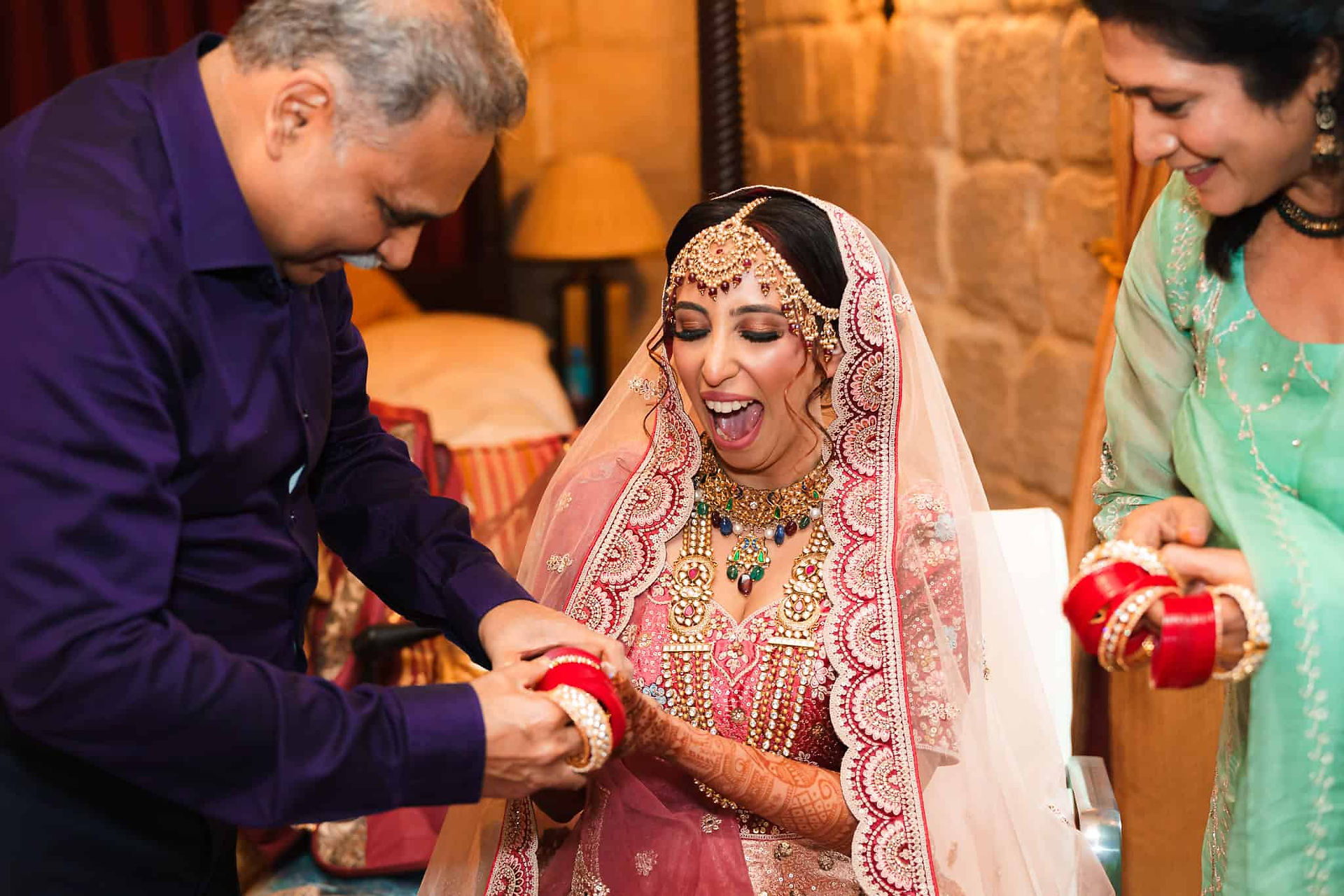 indian wedding bride receiving gift of jewellry at langley castle