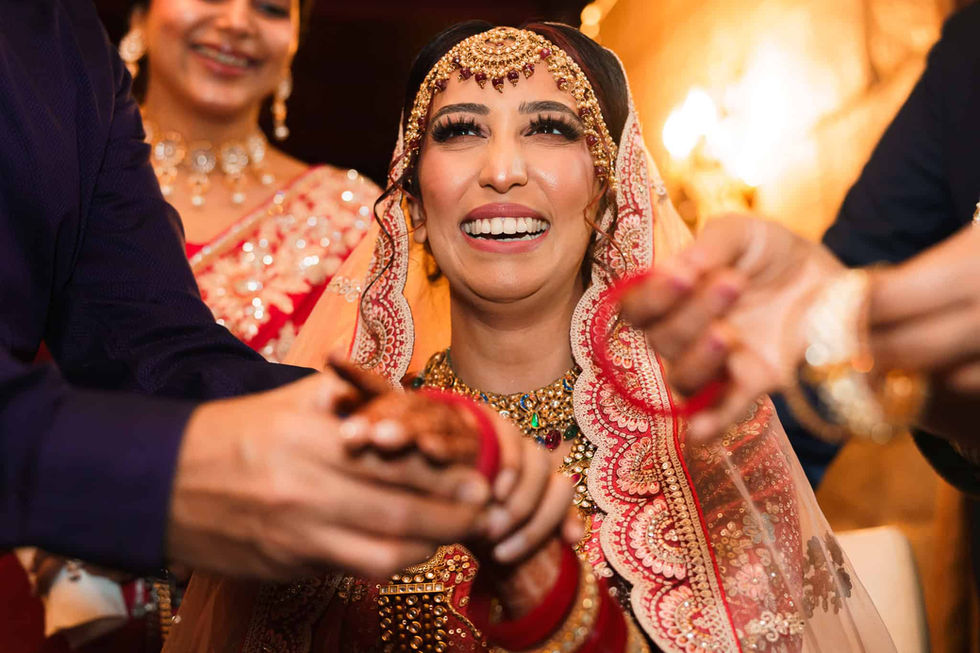 happy bride during indian wedding morning bride prep