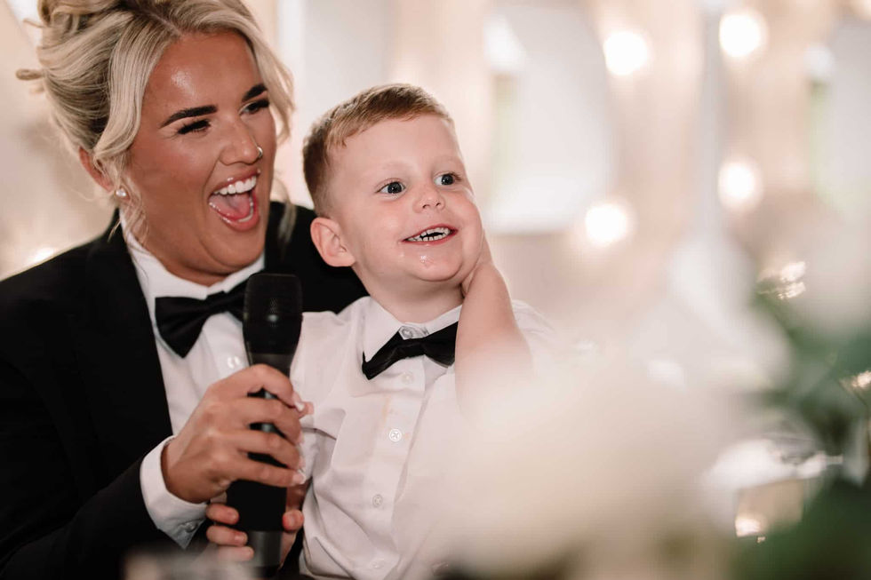 bride and son laughing during wedding speech at sporting lodge middlesbrough