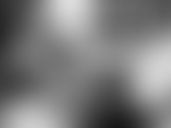 bride and groom holding hands at sunset with castle behind them