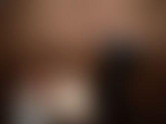 bride and groom cutting cake and laughing