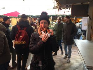Eating Brezel at the Christmas market in Merano, Alto Adige