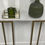 Thumbnail: Matte marble effect console table on gold L frame legs