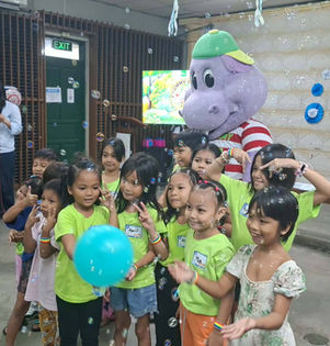 Happy children with Chummy Chum around