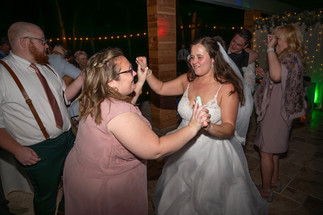 Bride and bridesmaid dancing