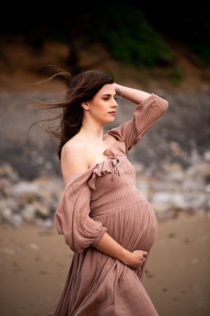 pregnant lady on the beach during maternity photoshoot with maternity Photographer Rachel Fairfield Photography