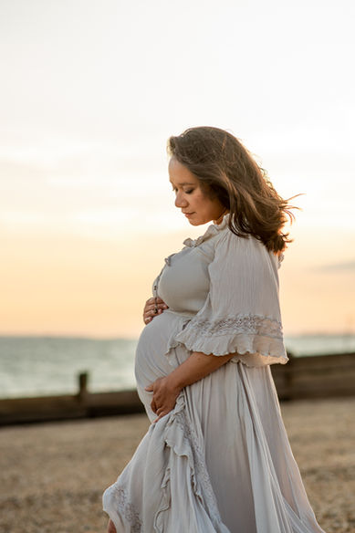 pregnant lady on the beach during maternity photoshoot with maternity Photographer Rachel Fairfield Photography