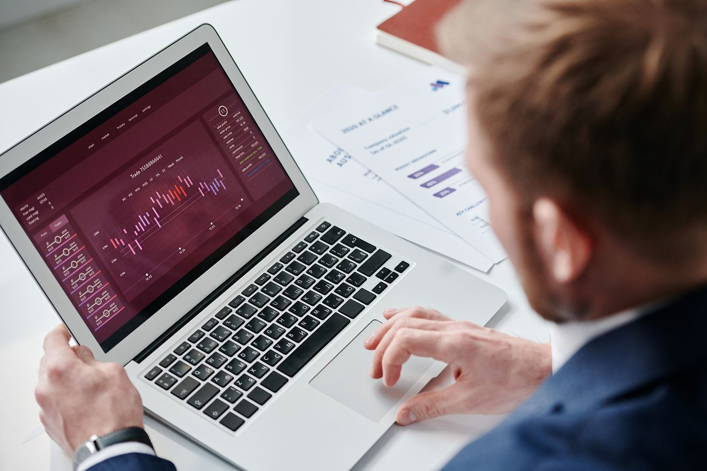 AI bookkeeping software showing real-time financial reports on a laptop