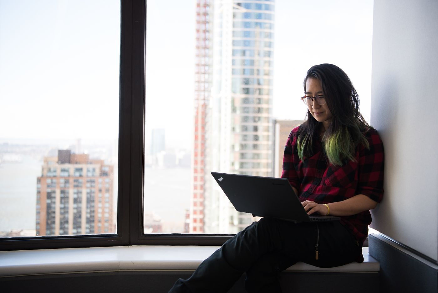 Small business owner comparing bookkeeping services for small business on a laptop