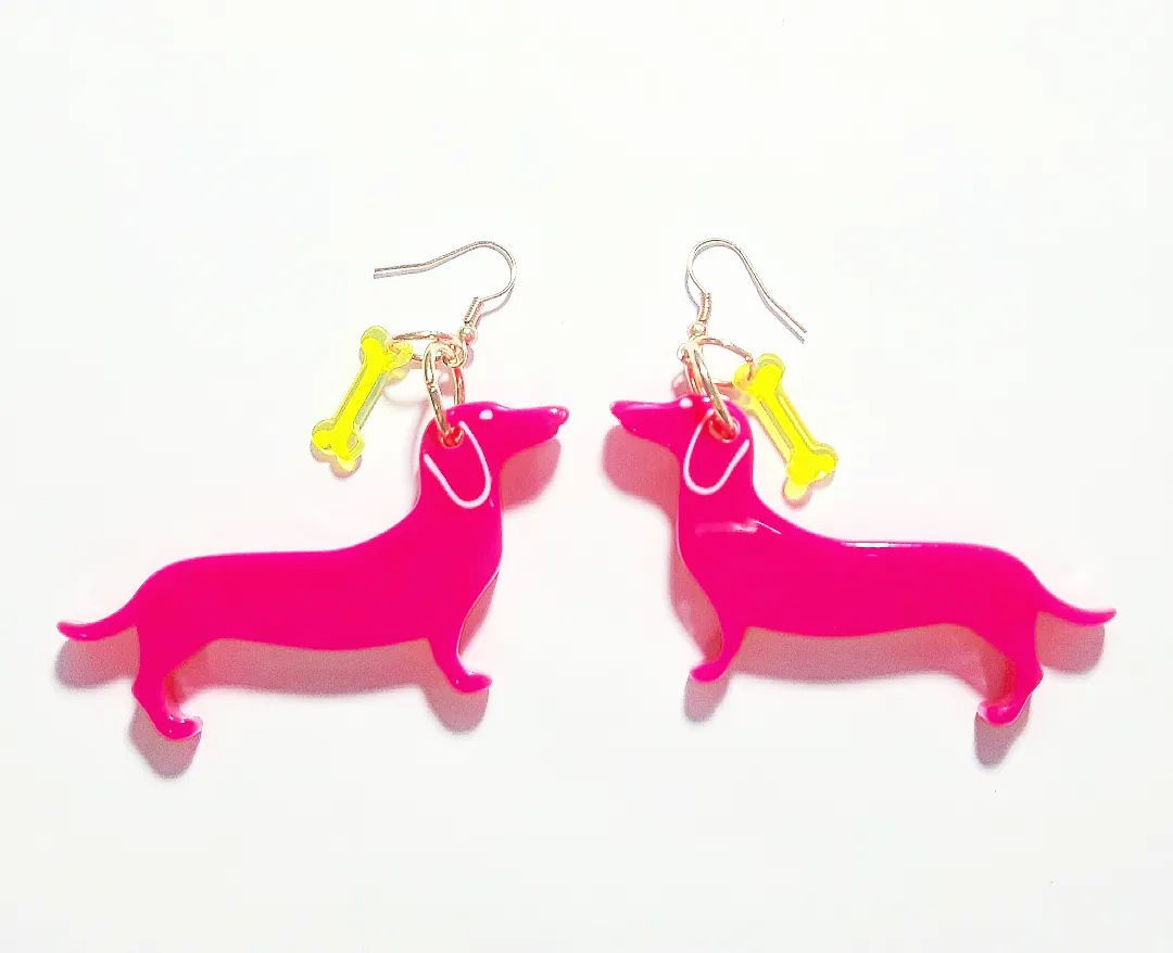 brinco de salsicha pink neon