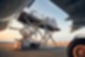 loading-of-cargo-containers-to-airplane-at-sunset-2023-11-27-05-27-27-utc.jpg