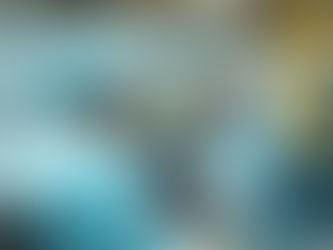 Three men wearing construction hats working in a warehouse.