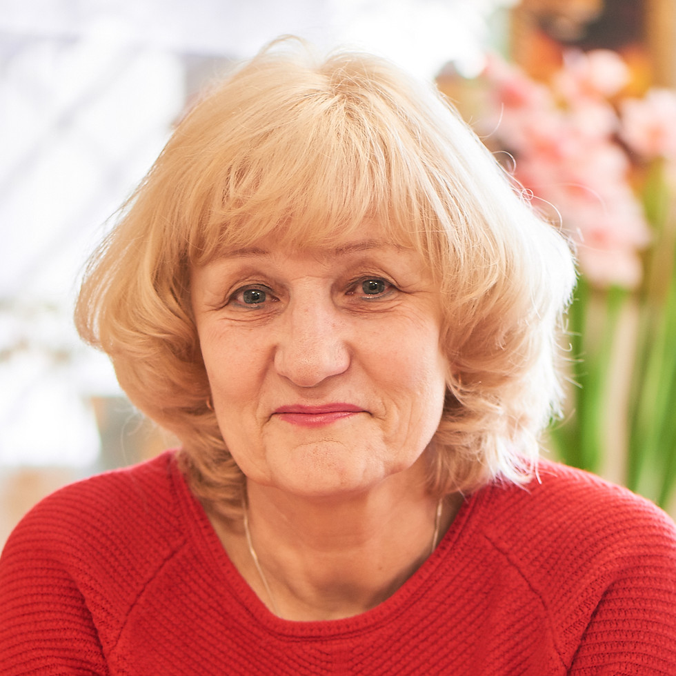happy-elderly-woman-sitting-red-sweater.jpg