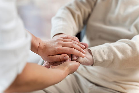 doctor-holding-hands-with-senior-patient.jpg