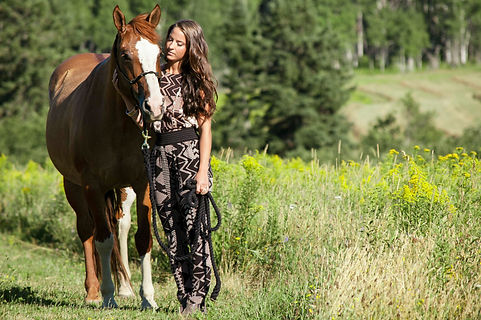 The relationship between a girl and her horse. This outfit features rose-gold accessories and tribal print matching separates from Le Chateau.