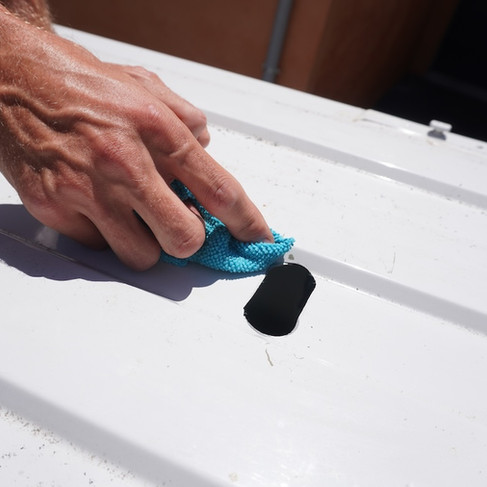 cleaning swarf from hole in van roof