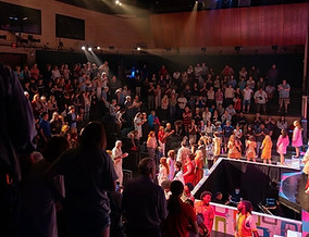 crowded Studio Theatre at the James Lumber Center