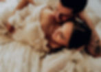 maternity-image-with-couple-on-bed