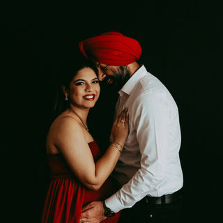 calgary maternity photography in studio woman in red and matching hijab