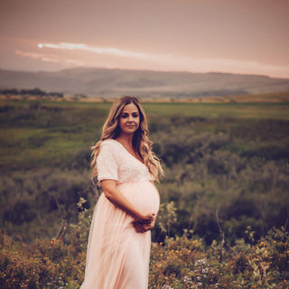 pregnant woman in pink gown at sunset in calgary nw