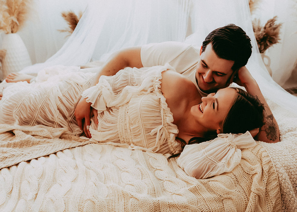 couple-on-bed-together-laughing-in-calgary-nw