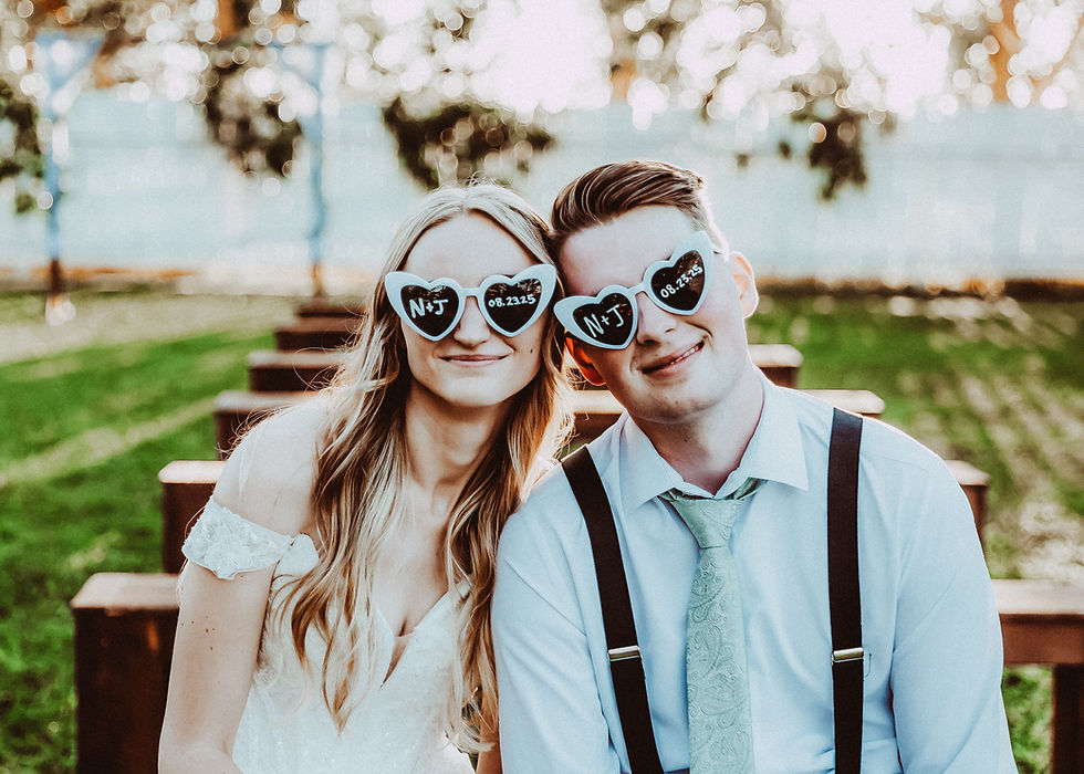Calgary wedding photography of couple wearng their sunglasses together. Candid and joyful moment captured by a NW Calgary wedding photographer.