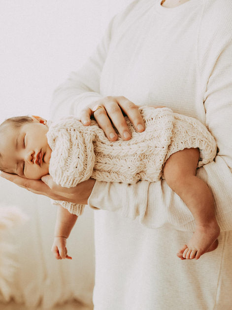 calgary newborn photography baby on dads arm