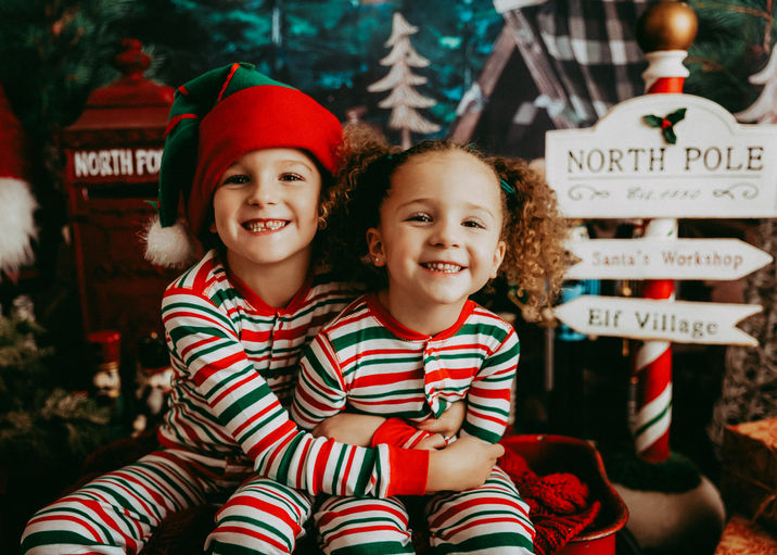 calgary-siblings-wearing-christmas-pjs-sitting-together