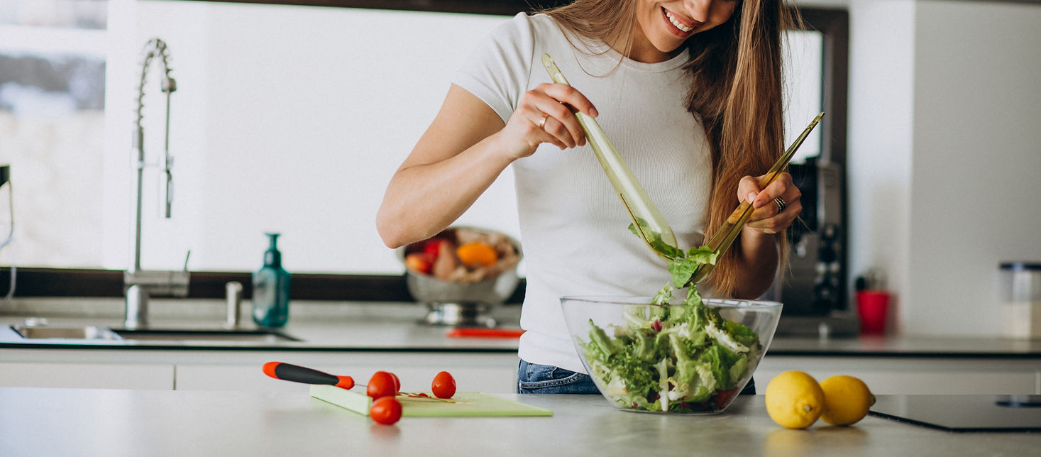 young-woman-making-salad-kitchen_edited.jpg