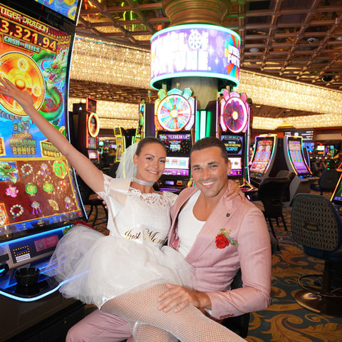 “Las Vegas Strip photoshoot—newlyweds with skyline after Chapel of Crystals ceremony”
