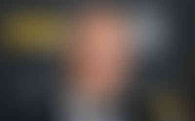 “Film director in a black tuxedo and bow tie smiling on a Directors Guild of America awards red carpet.”