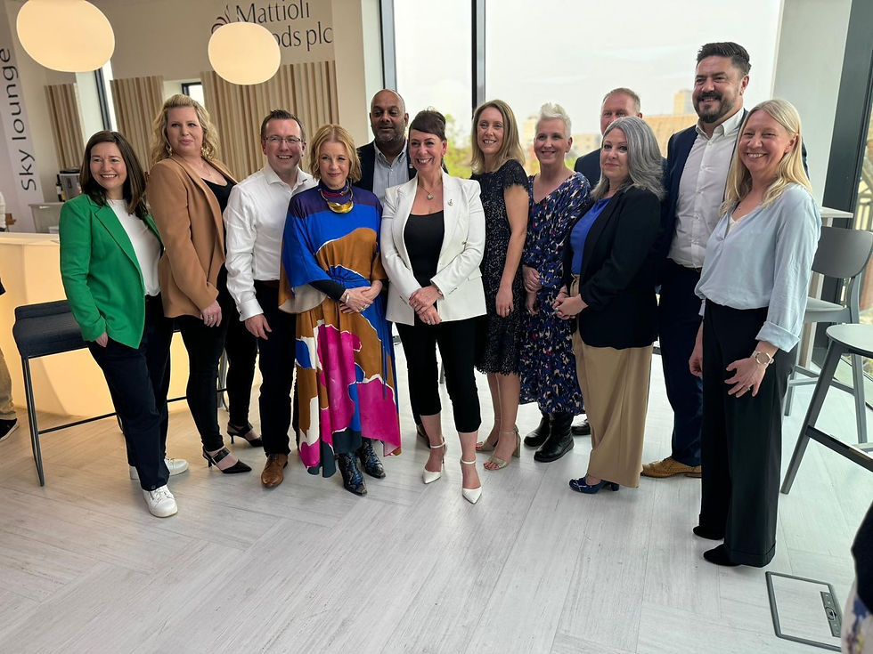 A group of 11 people pose for a photo