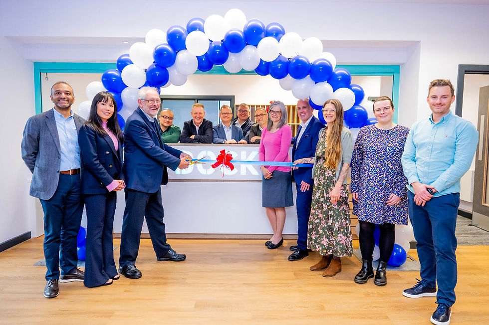 group pf people cutting a ribbon at The Dock Workspace Leicester