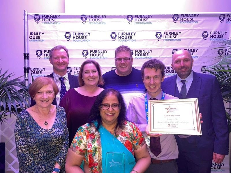 Team at mental health charity Lamp winning their Leicestershire Community Champion award for best campaign