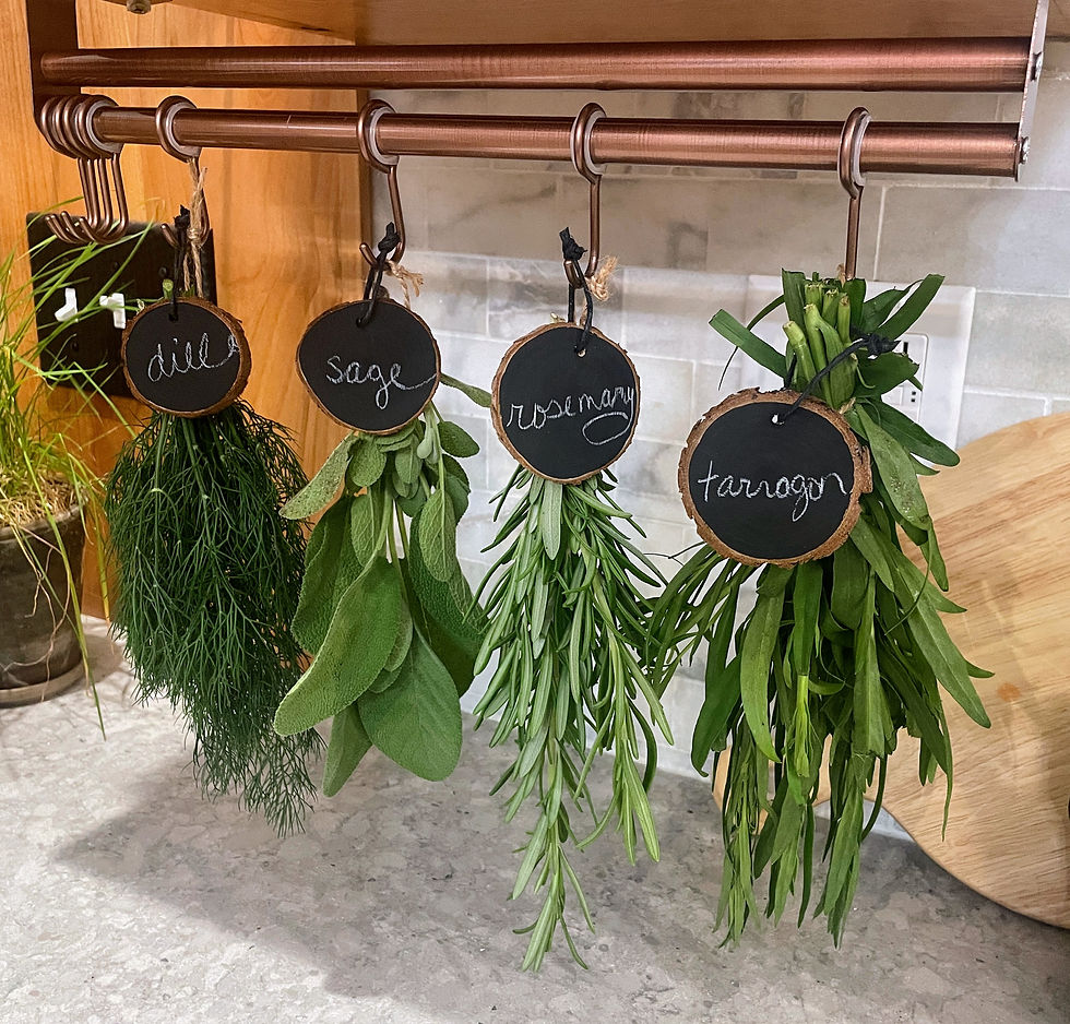 herbs air drying on copper hanging rack