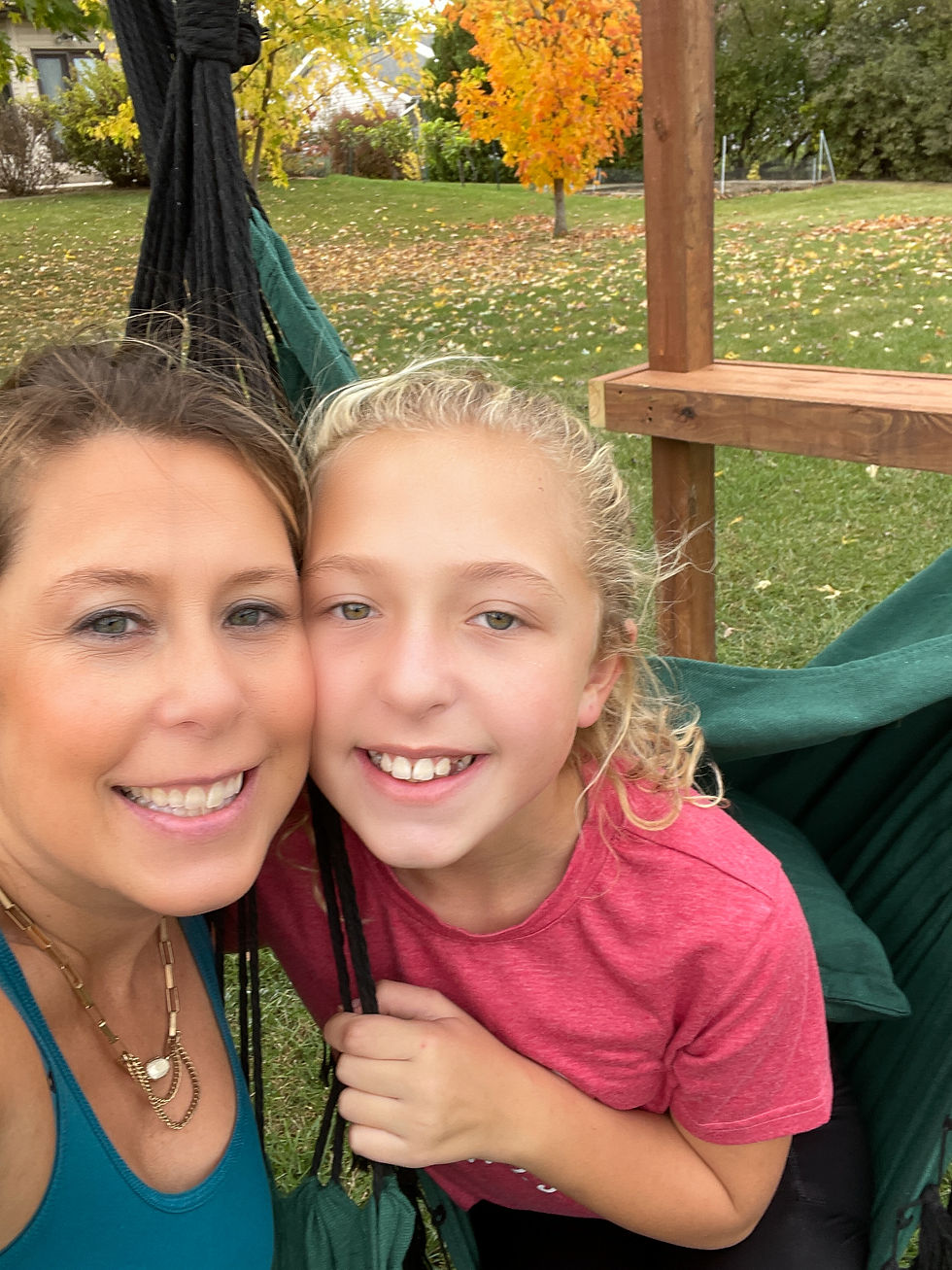 mother and daughter close up on pergola swing set